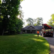 An open yard and driveway in front of a northern MN cabin.