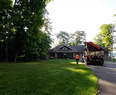 An open yard and driveway in front of a northern MN cabin.